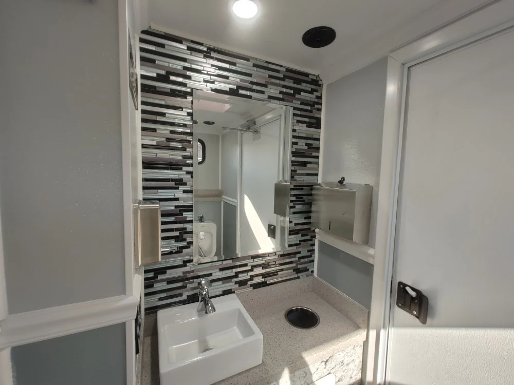Luxury restroom trailer interior with included standard features
