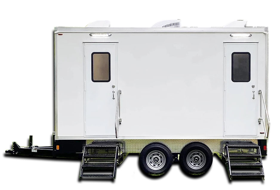 Side view of a white 2 stall restroom trailer